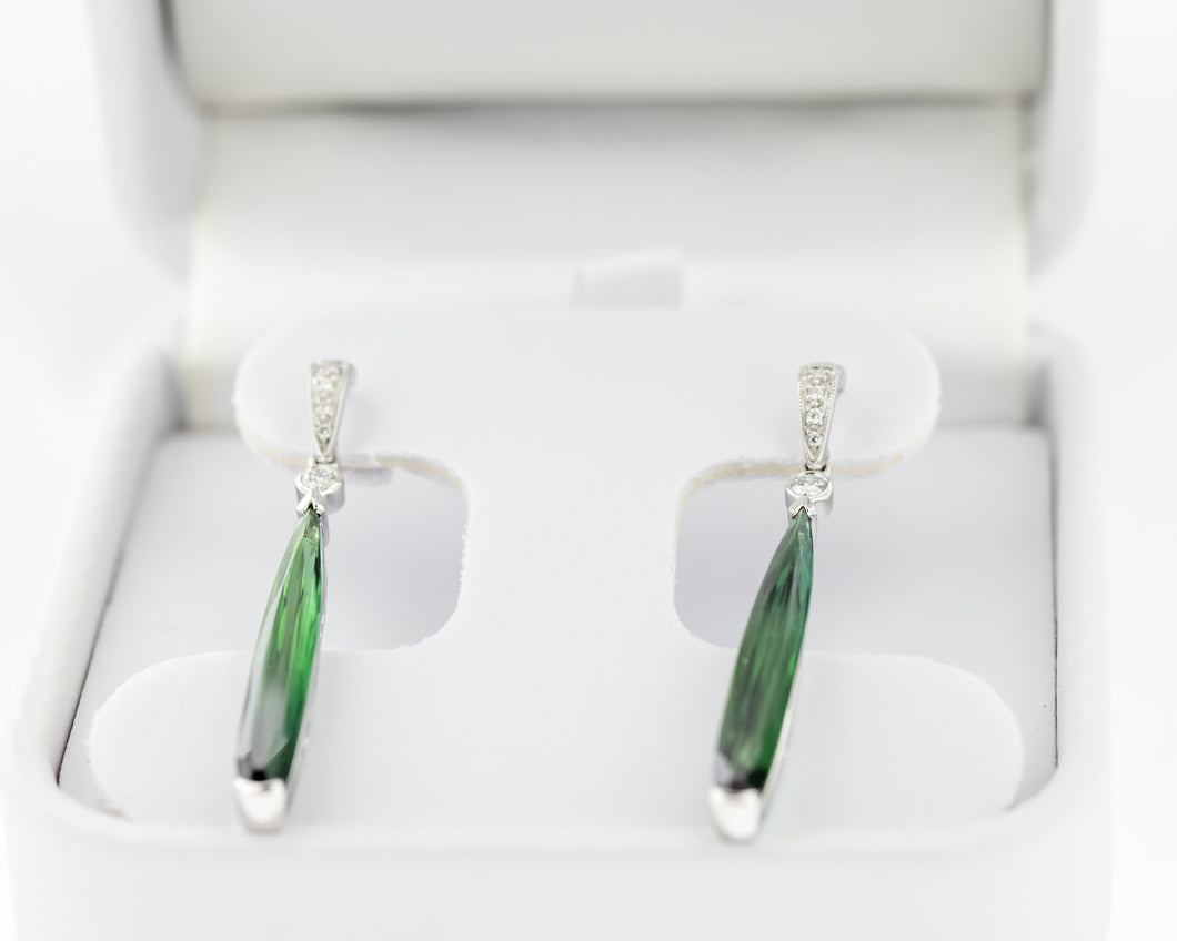 14kt white gold earrings set with two matching Green Tourmalines