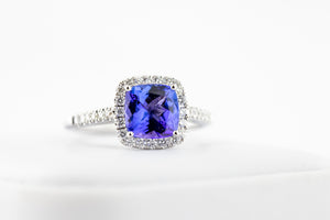14kt White gold ring with a genuine 1.61ct cushion cut Tanzanite and .28ct diamonds